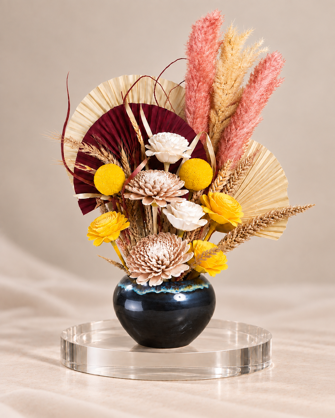 Sunset Serenade Palm and Feather Arrangement